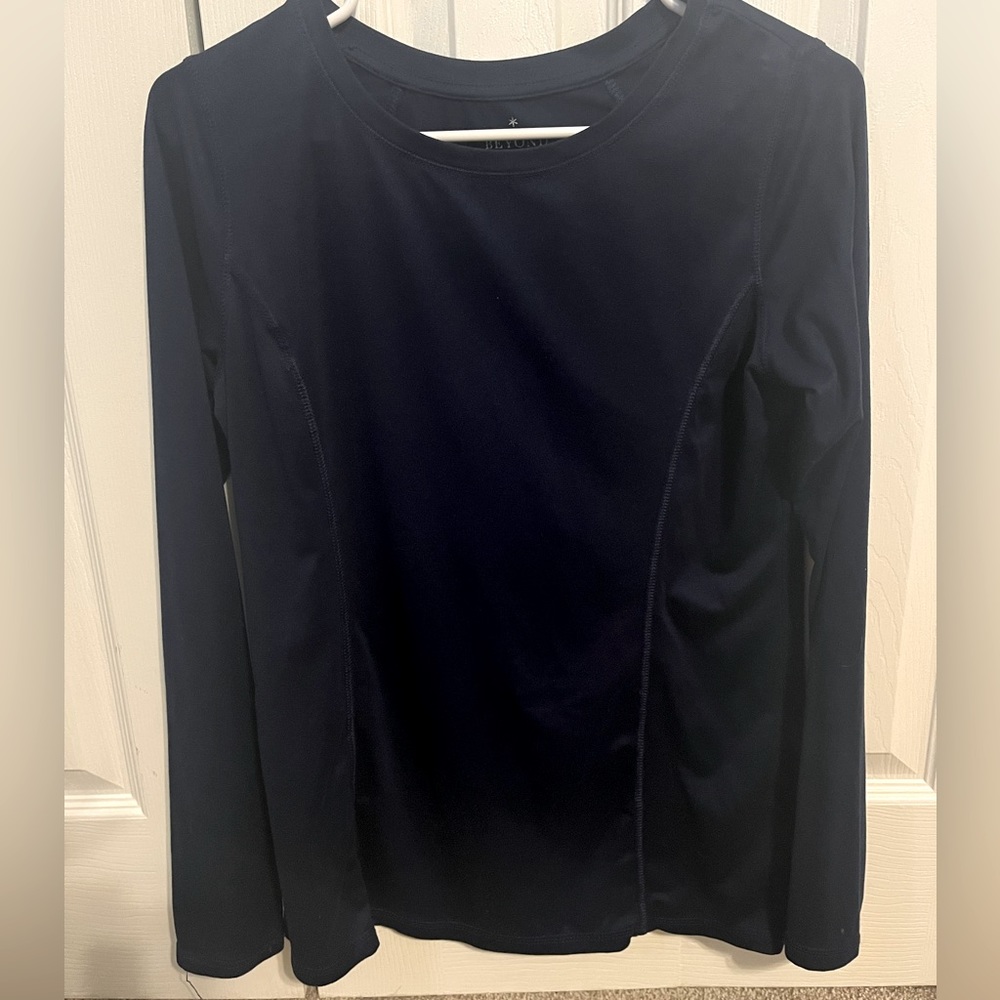 Navy blue Beyond Scrubs long sleeve shirt. Dri-fit material